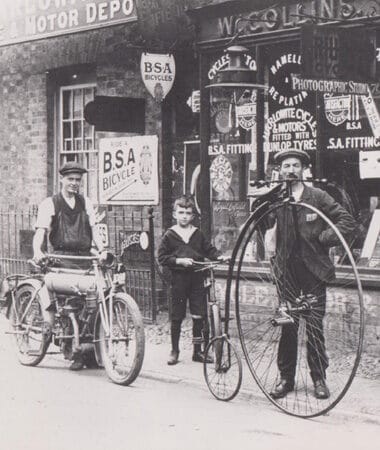 Photograph of Two Men and a Boy on Bicycles