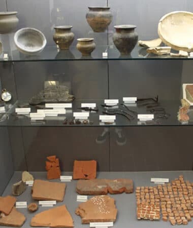 Cabinet Full of Pottery Pieces at the Harlow Museum